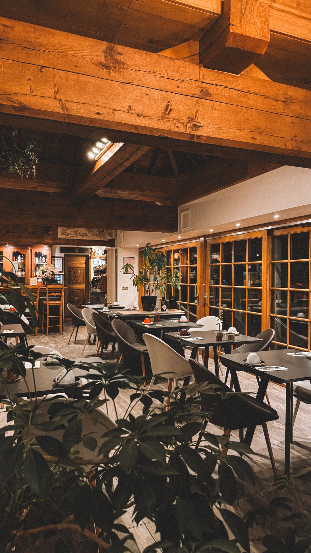 Cozy rustic restaurant interior with warm wooden beams